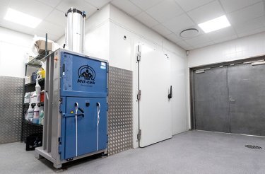 blue mil-tek baler in tidy back room at Burger King